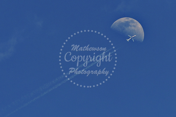 A jet transits the Moon during the game with Mt. Olive